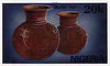 Nigeria 1990 Pottery - original hand-painted artwork for 20k value (Water Pot) by G Akinola similar to issued stamp on card 8.5" x 5" with 'Bromide Proof' h/stamp on back