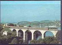 Postcard produced in 1980's in full colour showing GWR Hawksworth County Class 4-6-0 'County of Oxford', the Royal albert Bridge in background, unused and pristine