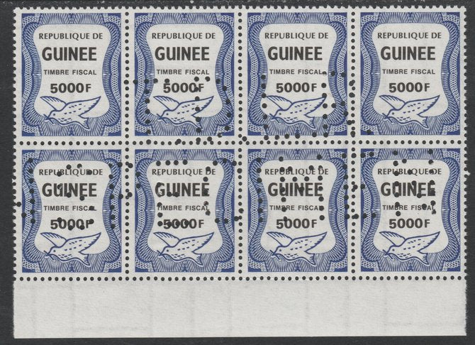 Guinea - Conakry 1987 Dove 5000f Revenue stamp in block of 8 showing complete perfin 'T.D.L.R. SPECIMEN' unmounted mint ex De La Rue archive sheet and rare thus