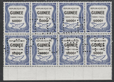 Guinea - Conakry 1987 Dove 5000f Revenue stamp in block of 8 showing complete perfin 'T.D.L.R. SPECIMEN' unmounted mint ex De La Rue archive sheet and rare thus