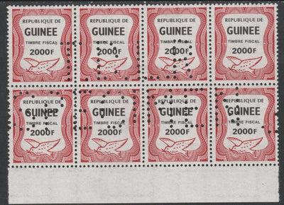 Guinea - Conakry 1987 Dove 2000f Revenue stamp in block of 8 showing complete perfin 'T.D.L.R. SPECIMEN' unmounted mint ex De La Rue archive sheet and rare thus