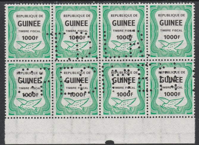 Guinea - Conakry 1987 Dove 1000f Revenue stamp in block of 8 showing complete perfin 'T.D.L.R. SPECIMEN' unmounted mint ex De La Rue archive sheet and rare thus