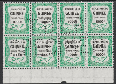 Guinea - Conakry 1987 Dove 1000f Revenue stamp in block of 8 showing complete perfin 'T.D.L.R. SPECIMEN' unmounted mint ex De La Rue archive sheet and rare thus