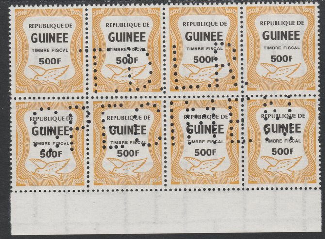 Guinea - Conakry 1987 Dove 500f Revenue stamp in block of 8 showing complete perfin 'T.D.L.R. SPECIMEN' unmounted mint ex De La Rue archive sheet and rare thus