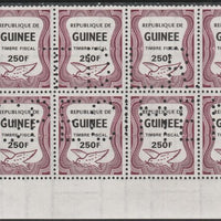 Guinea - Conakry 1987 Dove 250f Revenue stamp in block of 8 showing complete perfin 'T.D.L.R. SPECIMEN' unmounted mint ex De La Rue archive sheet and rare thus