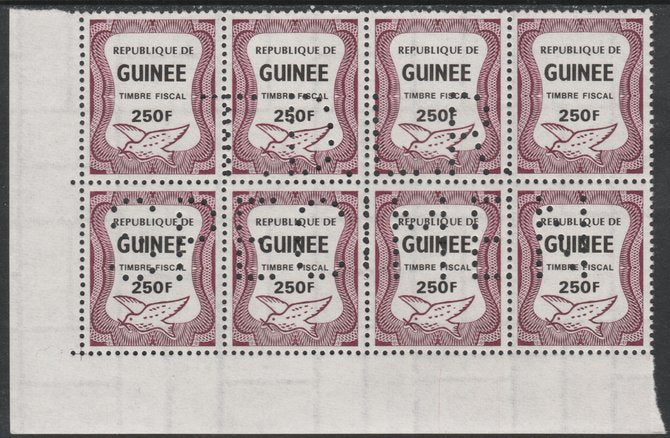 Guinea - Conakry 1987 Dove 250f Revenue stamp in block of 8 showing complete perfin 'T.D.L.R. SPECIMEN' unmounted mint ex De La Rue archive sheet and rare thus