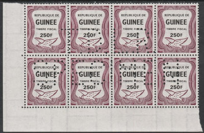 Guinea - Conakry 1987 Dove 250f Revenue stamp in block of 8 showing complete perfin 'T.D.L.R. SPECIMEN' unmounted mint ex De La Rue archive sheet and rare thus