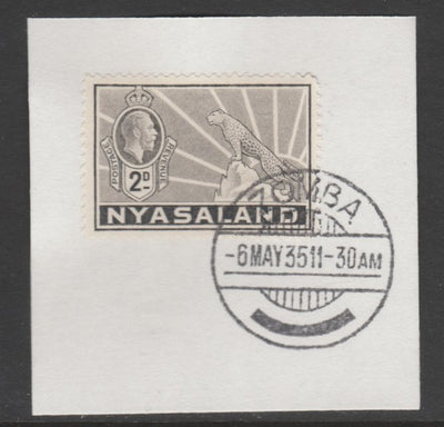 Nyasaland 1934-35 KG5 Leopard Symbol 2d pale grey SG 117 on piece with full strike of Madame Joseph forged postmark type 314