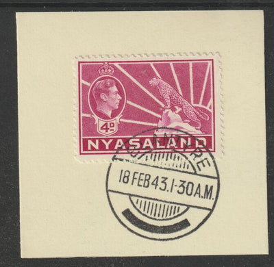 Nyasaland 1938-44 KG6 Leopard Symbol 4d magenta SG 135 on piece with full strike of Madame Joseph forged postmark type 317