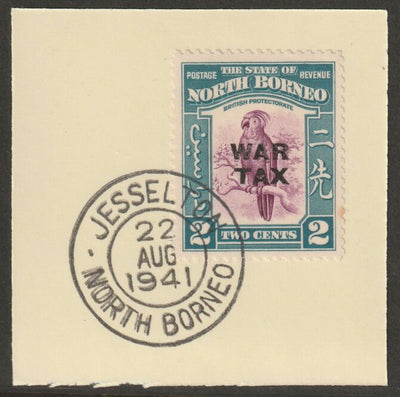 North Borneo 1941 WAR TAX overprinted on Cockatoo 2c on piece with full strike of Madame Joseph forged postmark type 310